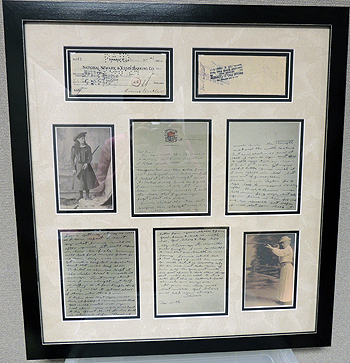 Image of the full set of documents framed.