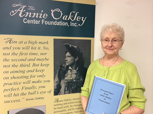 Photo of Marilyn Robbins holding her book